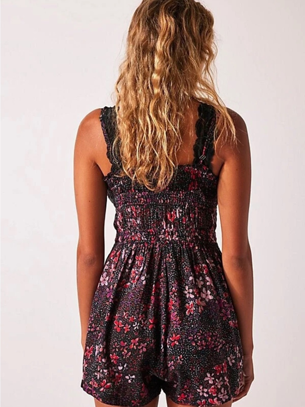 Free People Black Floral Smocked Romper with Pink Accents